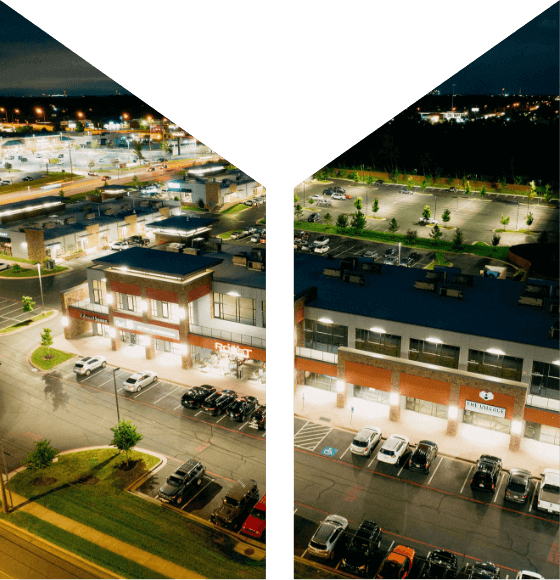 Aerial view of a shopping center, masked by the Mager's M logo